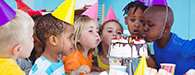 Children enjoying cake together