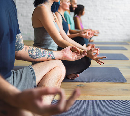 Men and Women in Meditation Class