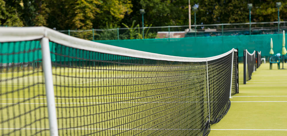 Tennis net on summer courts