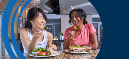 Two Female Mayfair Members enjoying a comfortable lunch meal together at Mayfair Parkway