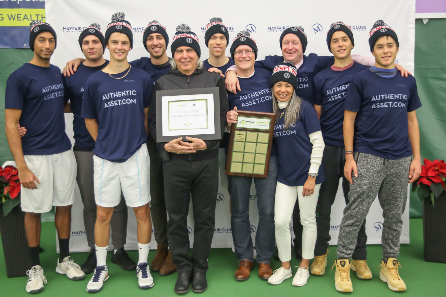 Image of George Fischer holding an award with the winning team from the Mayfair Toronto Pro League.