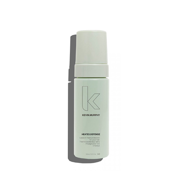 Product image of light green product bottle of heated defense treatment for hair from Kevin Murphy.
