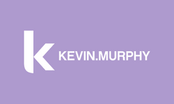 Purple button with the Kevin Murphy logo on it. Kevin Murphy is a line of hair care products.