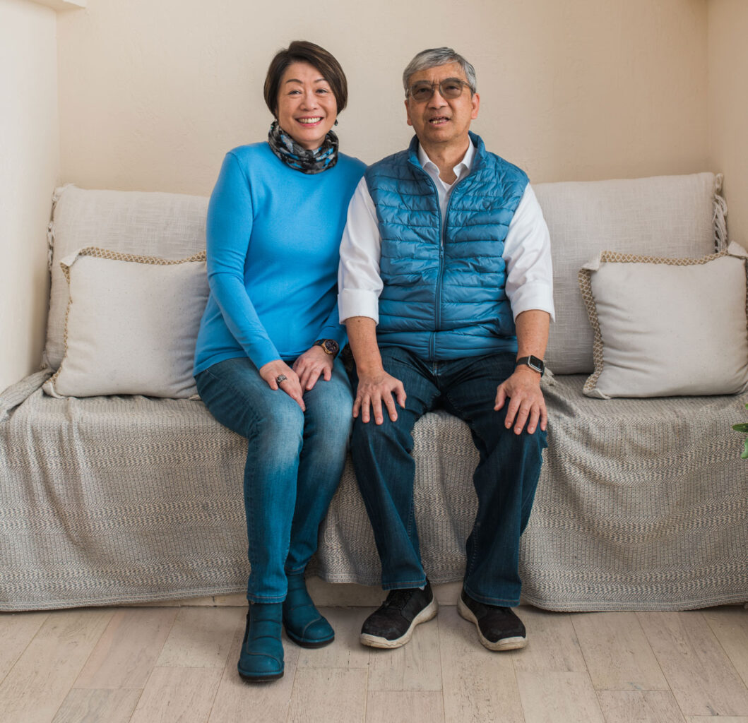 Image of Mayfair Members Arthur and his wife Esther sitting on a sofa.