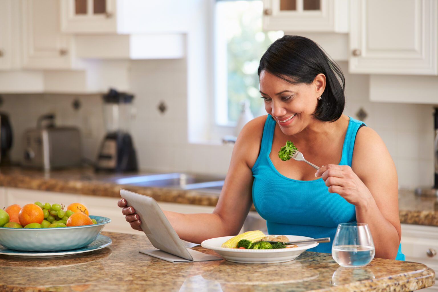 Woman With Digital Tablet Checking Calorie Intake Using Digital Tablet | Source iStock by Getty Images.