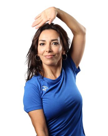 Image of Aysun, one of our Group Exercise instructors doing a dance move from one of her Zumba classes.