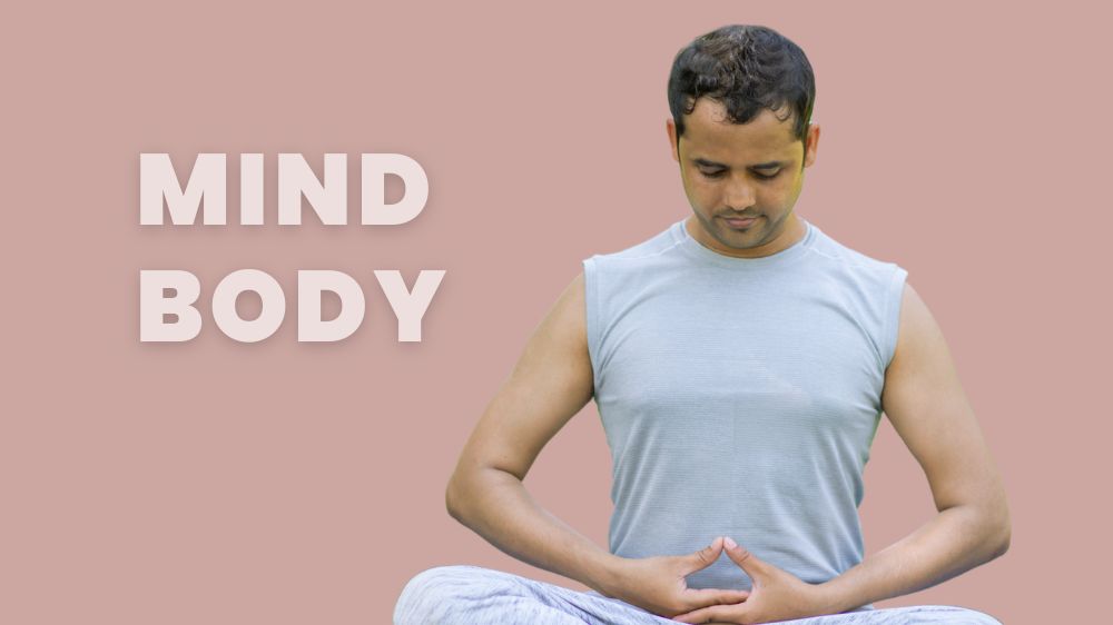 Image of a young man doing a simple sitting yoga pose.