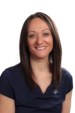 Headshot of our Group Fitness Assistant Rosie Davey in a black shirt.