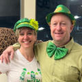Image of Jennifer Haley, General Manager of our Mayfair Parkway and east Clubs with Tennis Coordinator Ed Flanigan. They are wearing clothing for Saint Patrick's Day.