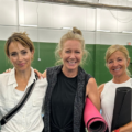 Group of Members at lakeshore on the Tennis Courts after Yoga Class