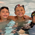 Group of boys in the pool as part of a summer camp at Mayfair West