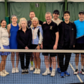 Group of members on tennis court